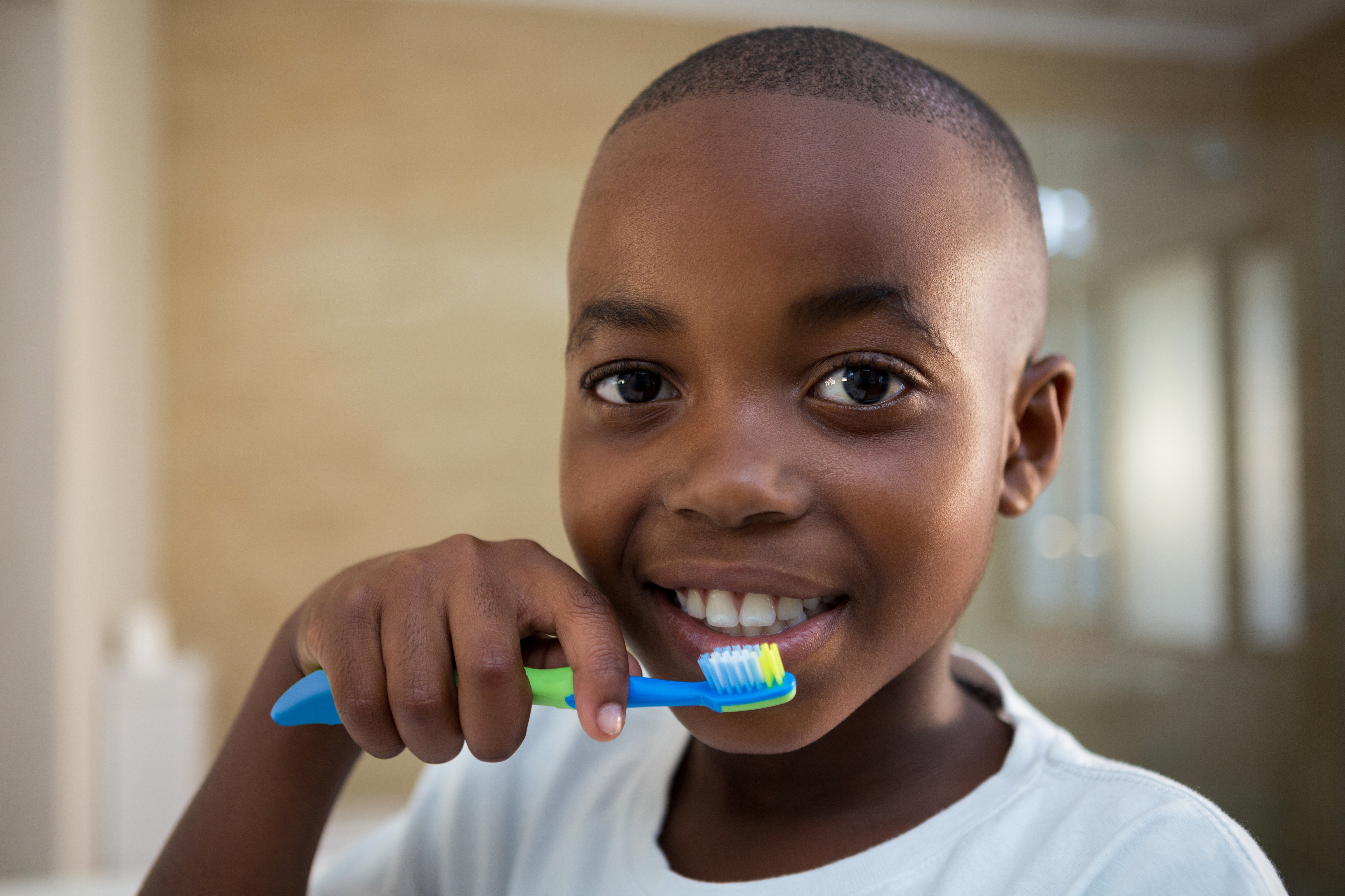 Close-up portrait of boy with toothbrush © Adobe Stock